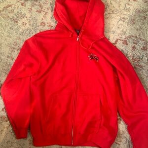 Red zip up stussy sweater, never worn.